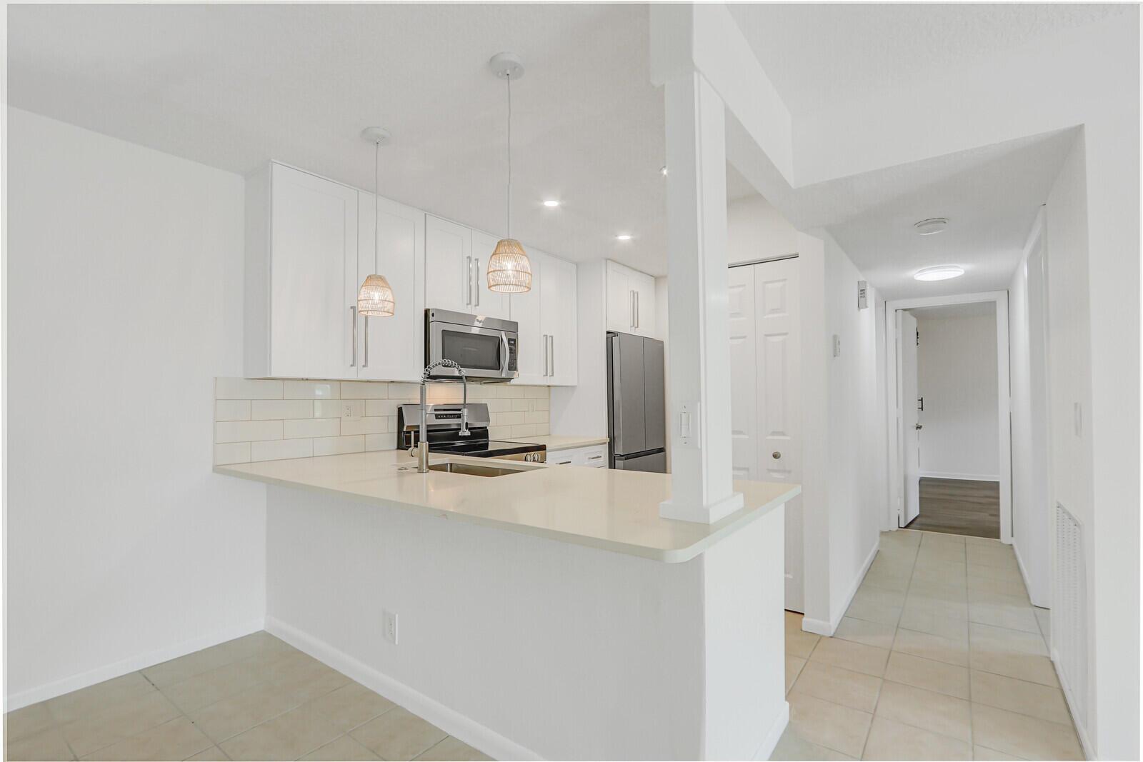 Just remodeled in Glenbrook! This stunning home features brand-new quartz countertops, stainless steel appliances, 42-inch designer shaker cabinetry, updated baths with new tile and vanities, and stylish light fixtures throughout. A charming barn door adds character, while abundant natural light creates a warm and inviting feel. Ideally located just minutes from the PGA corridor with shops and restaurants, as well as beautiful beaches and parks. A perfect blend of modern upgrades and prime location!