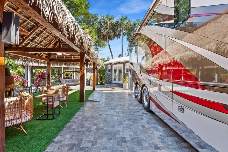 Discover this exceptional Class A Motorhome lot in the luxurious Aztec RV Resort.This phenomenal 6,911 sq.ft. lot feels like your own private resort, designed for luxury outdoor living.Relax beneath a grand 25x25 Tiki with a synthetic palm roof, complete with a custom outdoor kitchen, BBQ, and spacious lounge area.Unwind in the second Zen retreat Tiki, where a fire pit and cascading waterfall set the stage for unforgettable evenings under the stars.A private garage accommodates your car and golf cart, while a guest house offers every comfort a'' bathroom, shower, Murphy bed, washer/dryer, and A/C.Every detail has been crafted to perfection and is sold fully furnished to the highest standard. Just bring your suitcase and start living the dream !