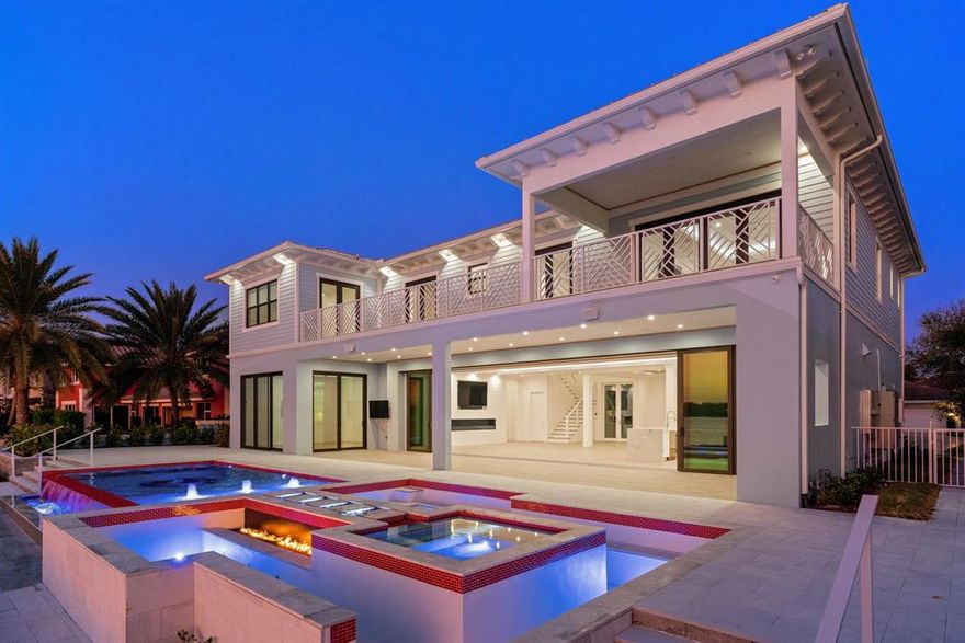 Stunning contemporary two-story residence with uncompromising views! BRAND NEW CONSTRUCTION on Hypoluxo Island's premier Point Manalapan with 5 bedrooms, 6.5 baths, media room, study, chef's kitchen, elevator and more. Less than a mile to the inlet and ocean access! Pictures are of the most recent project from builder.