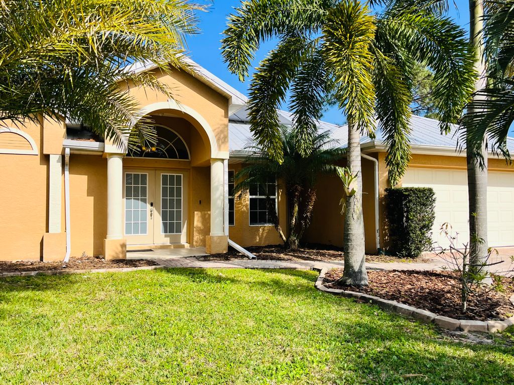 Photo of 3977 SW Helmlinger Street, Port St Lucie, FL 34953 (MLS # R10851791)