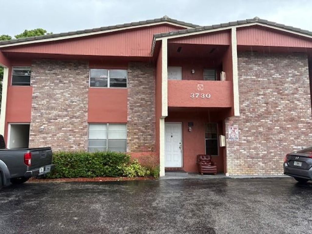 Photo of 3730 Woodside Dr, Coral Springs, FL 33065 (MLS # F10512090)