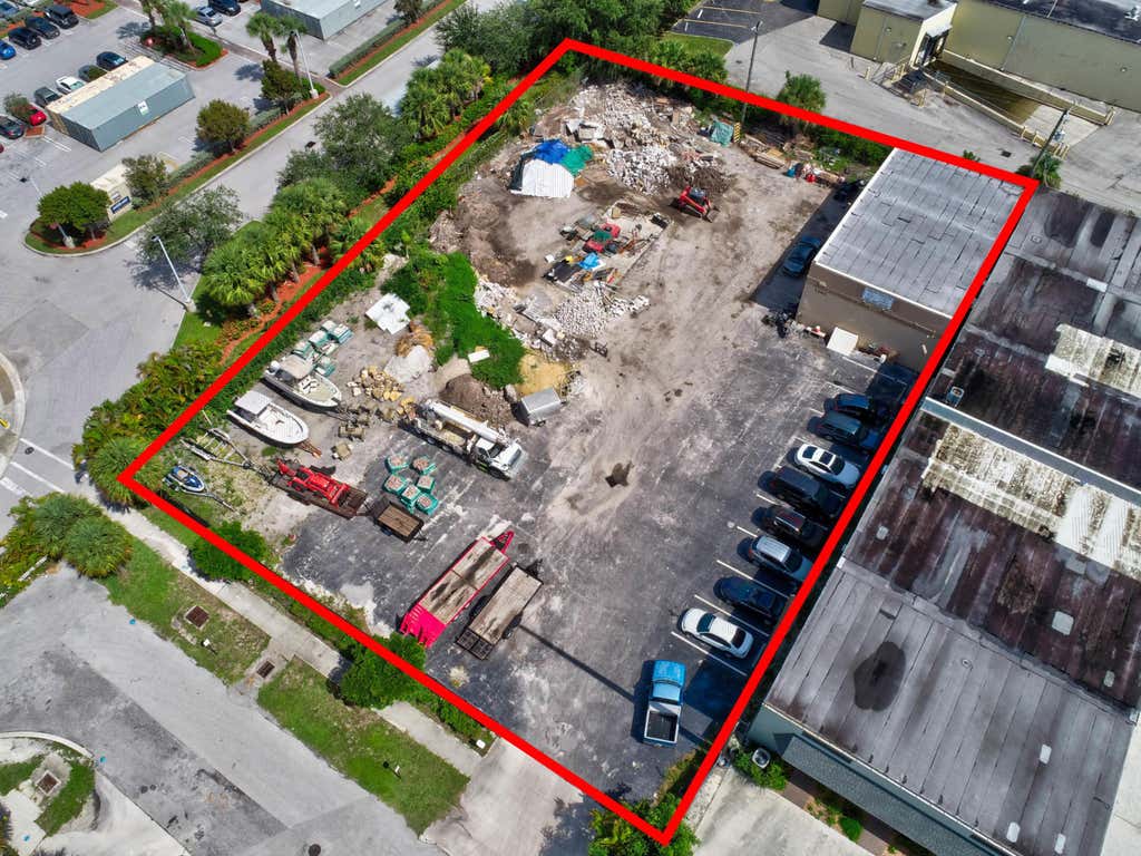 Photo of 1405 N Killian Drive, Lake Park, FL 33403 (MLS # B26059115)