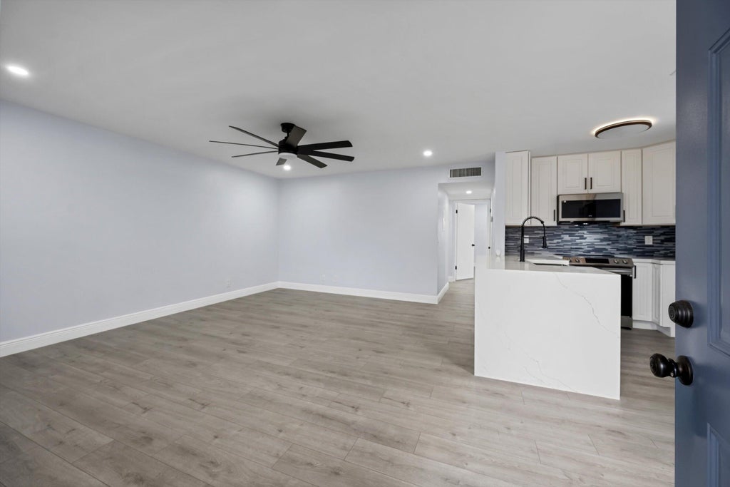 Photo of 29 Burgundy Drive #A, Delray Beach, FL 33484 (MLS # B26069077)