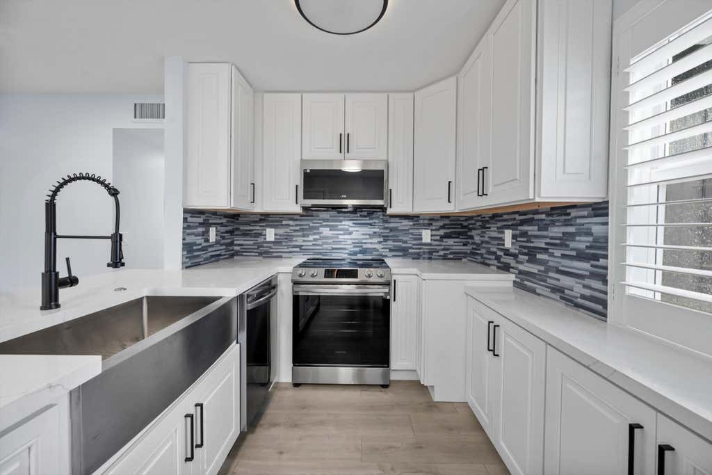 Photo of 29 Burgundy Drive #A, Delray Beach, FL 33484 (MLS # B26069077)