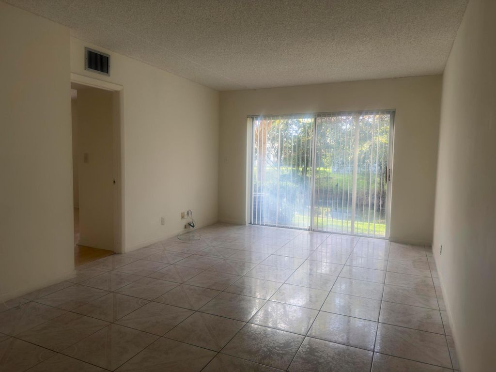 Photo of 3213 NW 103rd Terrace #107-c, Coral Springs, FL 33065 (MLS # B26002701)