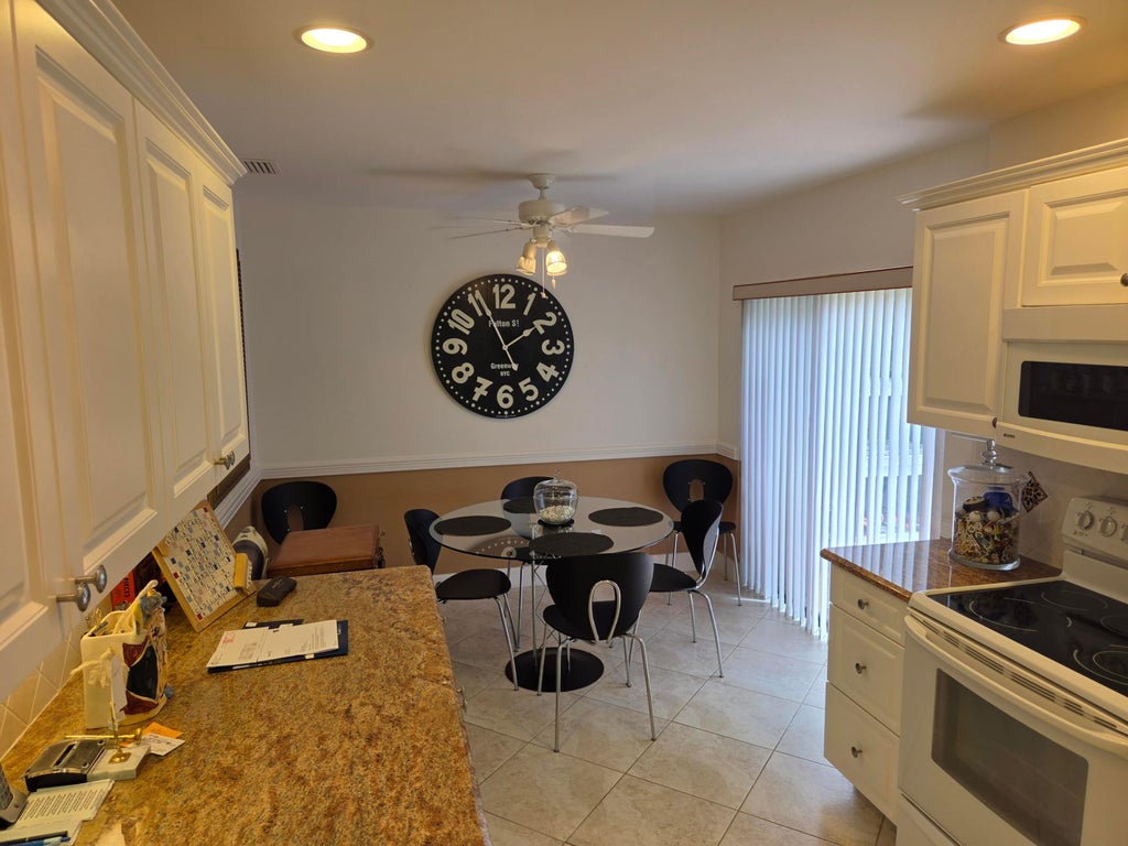 Photo of 61 EASTGATE Drive #A, Boynton Beach, FL 33436 (MLS # B26066835)