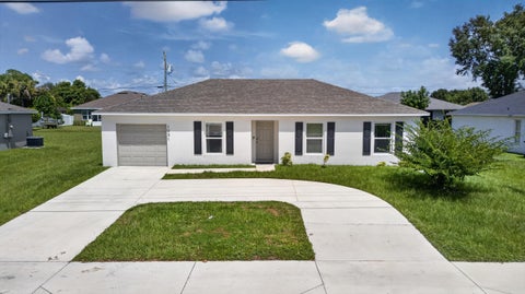 Photo of 1051 SW BECKER Road, Port Saint Lucie, FL 34953 (MLS # B26075584)