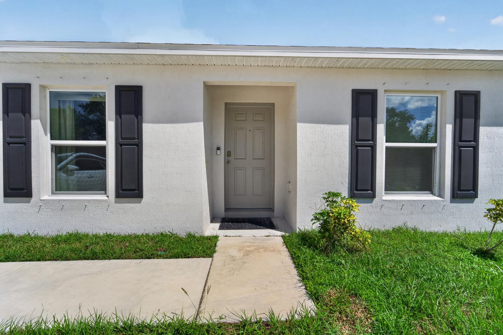 Photo of 1051 SW BECKER Road, Port Saint Lucie, FL 34953 (MLS # B26075584)