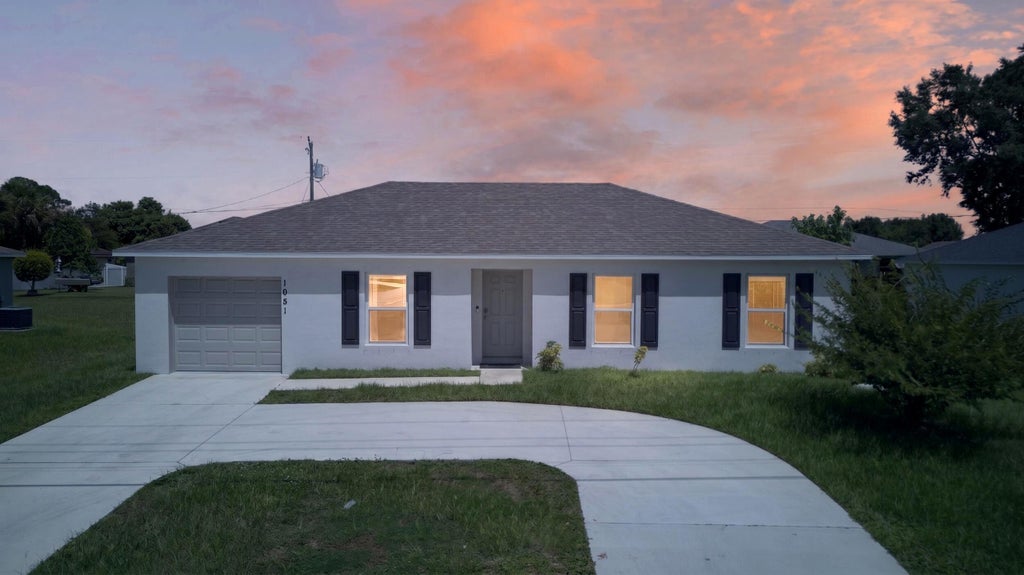 Photo of 1051 SW BECKER Road, Port Saint Lucie, FL 34953 (MLS # B26075584)