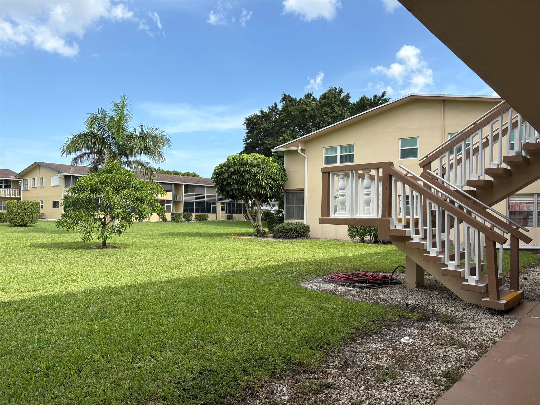 55 AND OVER COMMUNITY. Located in the highly desirable gated community of Century Village, this spacious, first floor condo boasts a large bedroom right off of the screened in patio and features tons of natural light as it is an END UNIT! Guest parking is available right out front, and laundry facilities are only a few steps away on the same floor. Enjoy nearby community amenities such as pools, shuffle board, billiards, pickle ball, tennis, racquetball, walking trails, library, and more. Clubhouse theatre seats 1,200 and features countless movies as well as shows. On site Walgreens Drug Store, doctor's office, and free on and off site transportation provided. The community also offers saunas, fitness centers, dance, yoga, and aerobic classes,​​‌​​​​‌​‌​​​‌‌​​​‌‌‌​​‌​​‌‌​​​​ sailing,