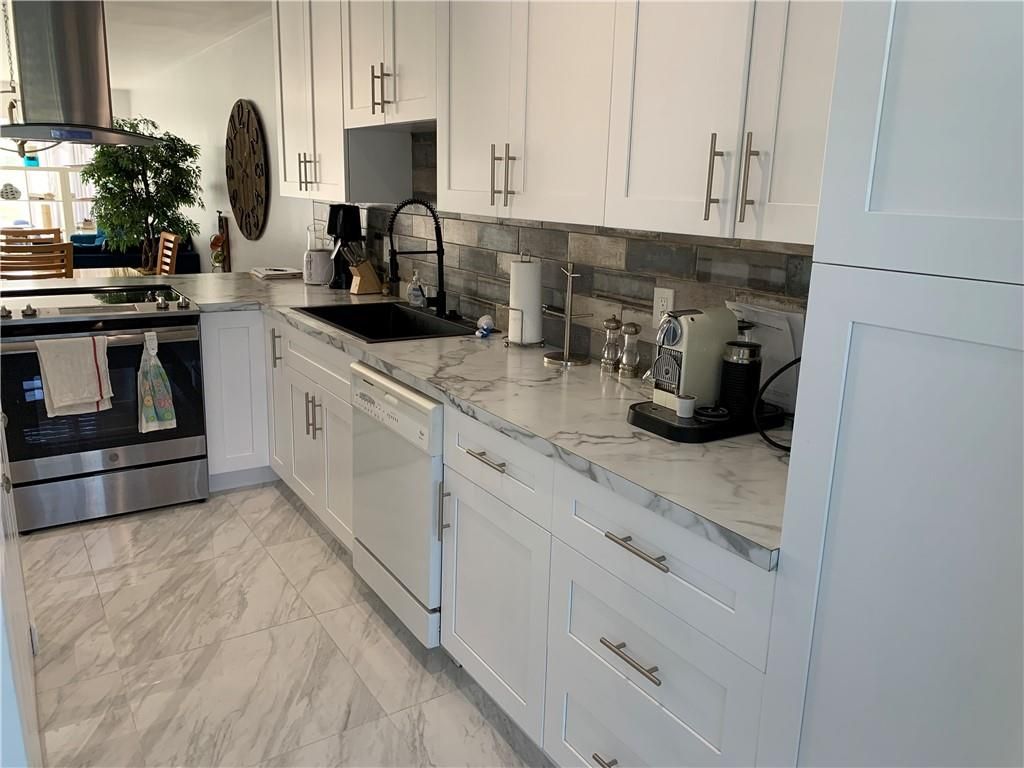 Photo of 1140 Boxwood Dr #103, Delray Beach, FL 33445 (MLS # F10280582)