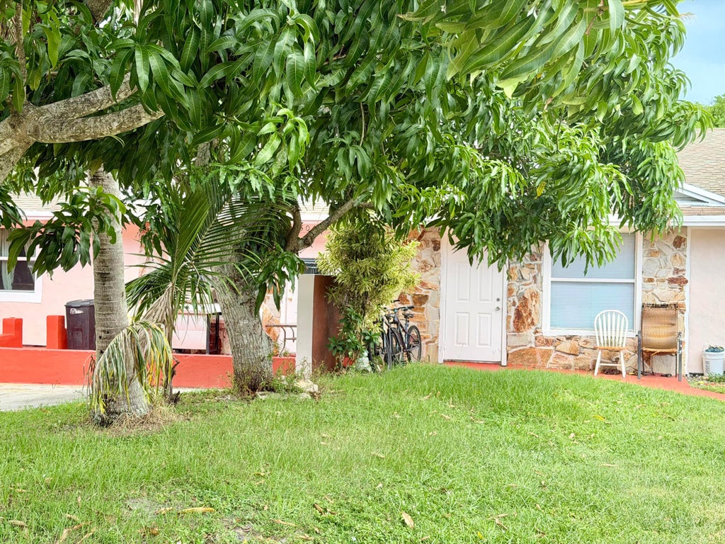 Photo of 5045 SE DRIFTWOOD Avenue, Stuart, FL 34997 (MLS # B26068981)