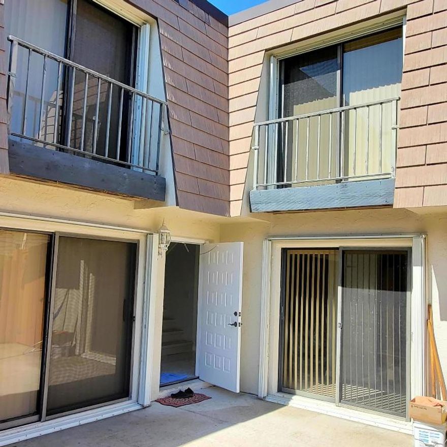 Nicely maintained Divosta  Quad accross from Jupiter Medical Center.  Recently painted new flooring and updated master bathroom.  Large fenced in patio for privacy and room to entertain.  Easy access to I-95, Military Trail & turnpike.  All tile and no carpet.