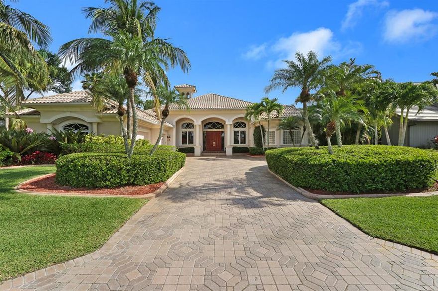 Truly one of the most beautiful homes in PGA National.  This gorgeous 5BR plus den (4,712 ac sq. ft - 6,135 total sq. ft) masterpiece located on the second hole of the PGA National Squire Golf Course offers everything one could wish for in a luxury residence!  Built by one of the premier builders in South Florida, Dreamstar, nothing was spared or overlooked in this impeccable home! Beginning with the soaring 14 foot double coffered ceilings to the beautiful 24'' Saturnia flooring, wood columns, fireplace & triple crown moldings.  Master bedroom includes an exercise area with 10 jet spa & re-heater, huge closets & instant hot water thru-out the entire home! Gourmet kitchen includes center island with granite countertops, 2 double gas ovens, 5 burner gas range, microwave oven, wine cooler, wood cabinets, new stainless steel Subzero refrigerator and freezer.  Family room & office mahogany built-ins!  Large screened patio are with pool, waterfall, paver deck, specialty lighting for the palm trees, summer kitchen with new grill, plus 2 yard entrances!  3 car garage with finished epoxy flooring, Garage Tech walls and extra storage cabinets!  3 air conditioners!