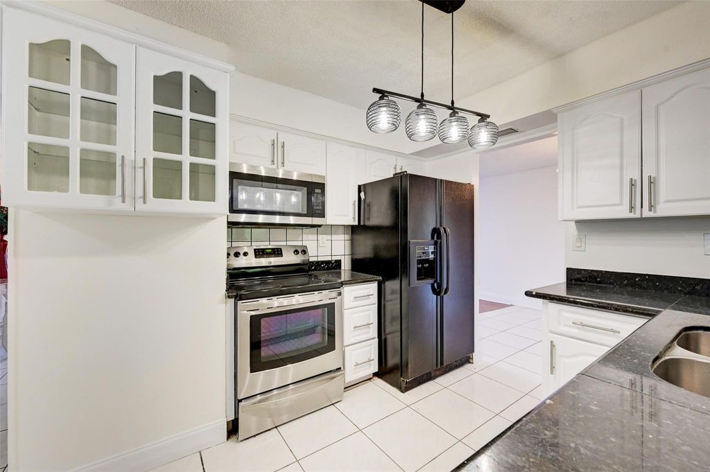 Photo of 2306 NW 98th Lane, Coral Springs, FL 33065 (MLS # F10407483)