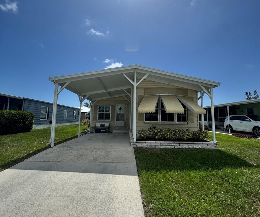 Lovely 2 bedroom 2 bath home. Located in the desirable 55+community of Spanish Lakes Country Club. Home is located near entrance of park and community center. The home has plantation shutters. Flooring is laminate and carpet. Laundry room is inside the home. New roof 2024, A/C is 2016 and has been maintained well. Fans in bedrooms. Home has new sink valves, new facets, and new toilets.Large Florida room 23'4'' X10'.5'' great for morning coffee or evening cocktails. Has separate A/C unit for those hot summer days.Home is being sold fully furnished.  Lawn care, trash removal and golf included in lot rent. 2 pools, tennis, pickleball, bocce ball, shuffle board. club house and much more. Must See!