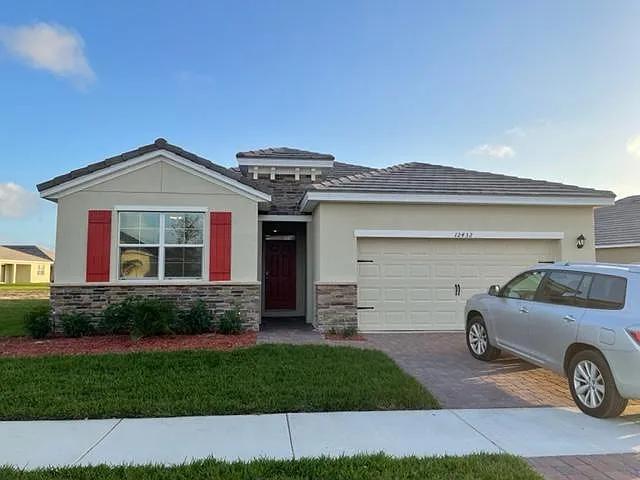 Stunning 4BR/2.5BA DR Horton home with lakefront views in gated ''The Estates'' at The Preserves, just 2 miles from downtown Tradition.Renovated May 2025: new flooring, interior paint, granite vanities, crown molding, and added half bath. Over 2,000 sq ft + 400 sq ft garage and 220 sq ft screened lanai with Ox Floors coating. Open layout, quartz counters, walk-in pantry, high ceilings, new washer/dryer. Master suite with dual closets and large ensuite. HOA includes lawn care, pool, dog park, and trails. Security system & phone line included. Pets allowed w/approval. Available now!