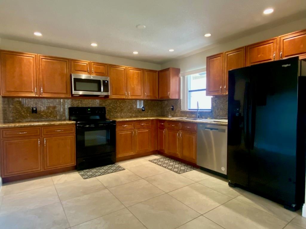 Beautiful 3/2 for you to make your new home! This fabulous corner unit features lots of natural light, gorgeous tile throughout, granite counters in the kitchen and bathrooms, vaulted knockdown ceilings, and an open layout with a split bedroom floor plan. Large kitchen can fit a breakfast table or island, has plenty of storage, slow close drawers, and new dishwasher. Feel safe with impact windows in the primary bedroom and accordion shutters for all other windows. Enjoy sitting outside on your spacious screened balcony, which also has a storage closet. Set up your private viewing today!