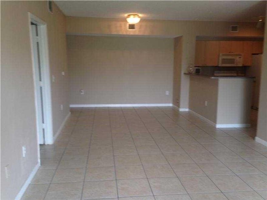 WOWZER!!! 3/2 IN GATED COMMUNITY, CENTRALLY LOCATED IN WEST TAMARAC CLOSE TO THE SAWGRASS XPRESSWAY. SPACIOUS AND BRIGHT UNIT, HIGH VAULTED CEILINGS, SPLIT BEDROOM PLAN. TROPICAL POOL SETTING, GYM AND CLUBHOUSE.