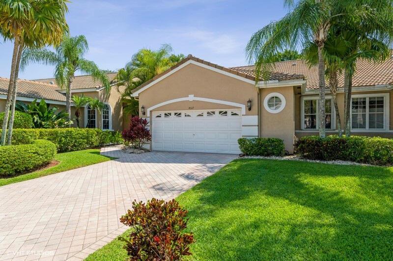 Enjoy an easy and full life in Wycliffe Country Club! Quiet location with contemporary renovations, tall ceilings, and a 3 way split floor plan. Office easily converts to a 3rd bedroom. Great location: Short walk to the modern renovated clubhouse with 5 dining venues, spa, golf, fitness center, tennis, newly updated pickleball courts, and seemingly endless activities. Steps to Cambridge pool. One of the largest backyards in this neighborhood + lushly landscaped for privacy. Accordion hurricane shutters. Great room wide crown molding, bathroom seamless glass sliding doors, kitchen pullout pantry drawers, LED lighting, solid core interior doors, Levolor darkout shades in master bedroom, and epoxy fleck garage floor. Golf cart may sweeten the deal. New roof: Aug. 2013. Low Cambridge taxes.