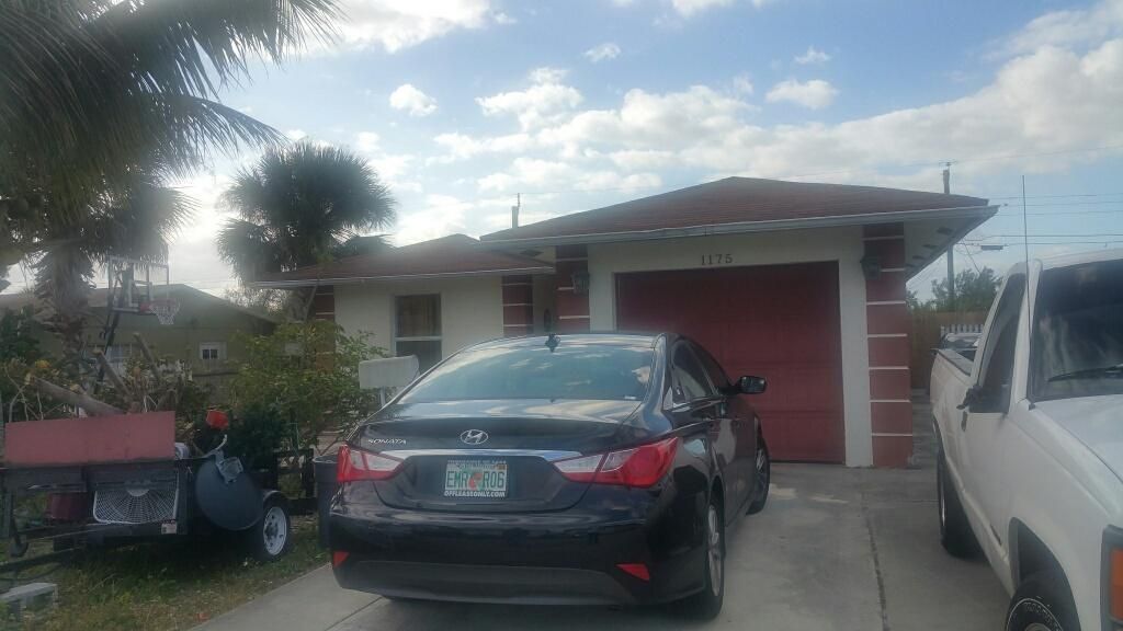 Photo of 1175 W 34th Street, Riviera Beach, FL 33404 (MLS # B26049111)