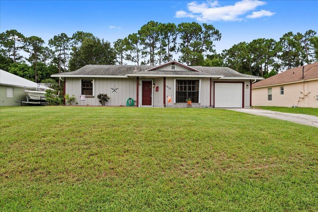 Photo of 1512 SW Hunnicut Avenue, Port St Lucie, FL 34953 (MLS # R10898018)