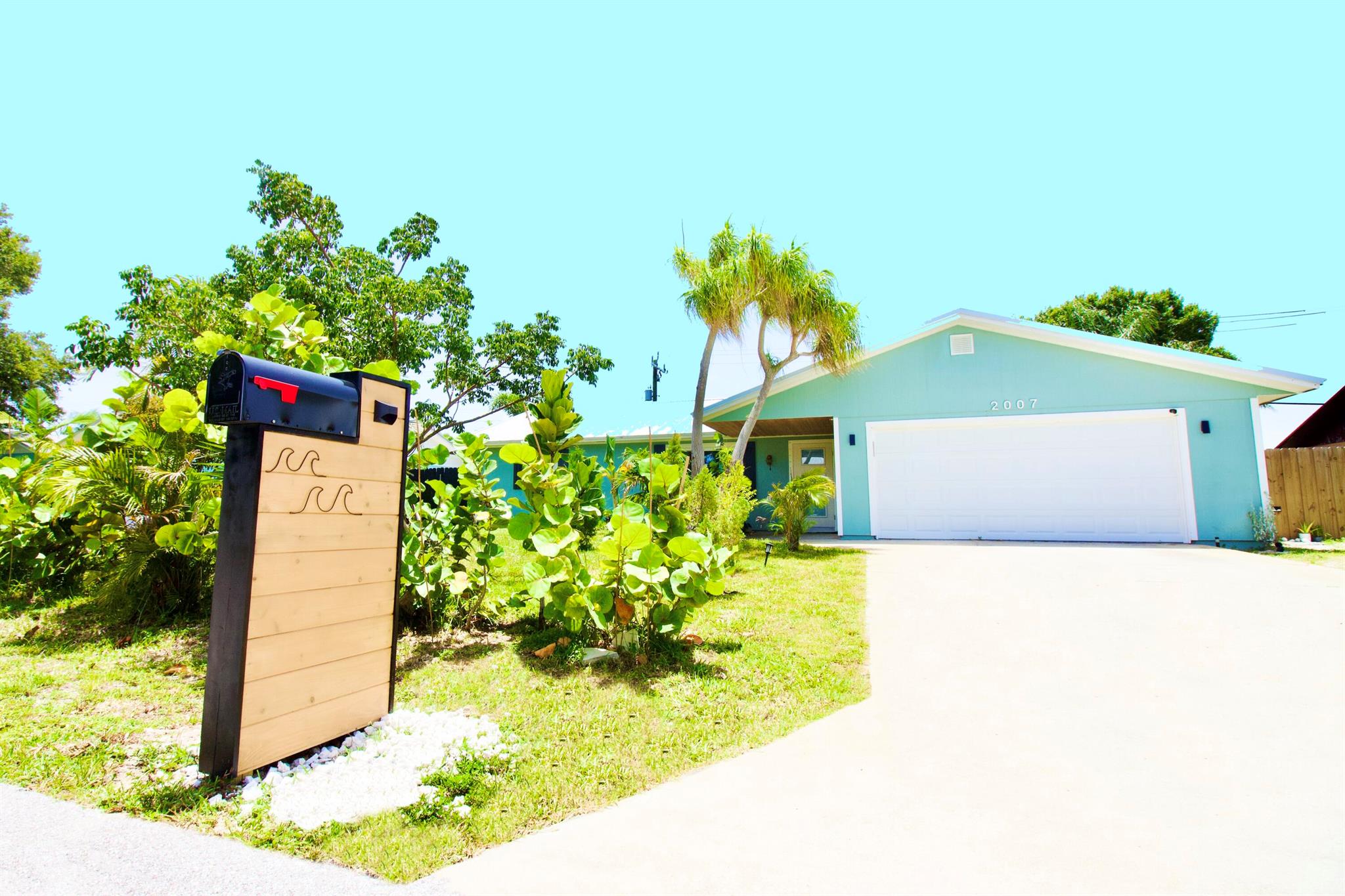 Welcome to this beautifully updated home, high and dry in Jensen Beach! Situated on a peaceful street, this gem boasts a new metal roof, new HVAC, new electrical updating, remodeled bathrooms, and a stunningly remodeled kitchen with quartz countertops. The open-concept design enhances the flow of natural light, creating a warm and inviting atmosphere. Enjoy the latest in modern living with new appliances, impact doors and windows, and a new garage door/motor. Relax and enjoy peaceful evenings under the new pergola in the fully fenced backyard. This oasis is located just 5 minutes from downtown and9 minutes from the beach, with easy access to West Palm Beach. Perfect for families, this home combines comfort, style, and convenience. Don't miss out on this turnkey beauty!