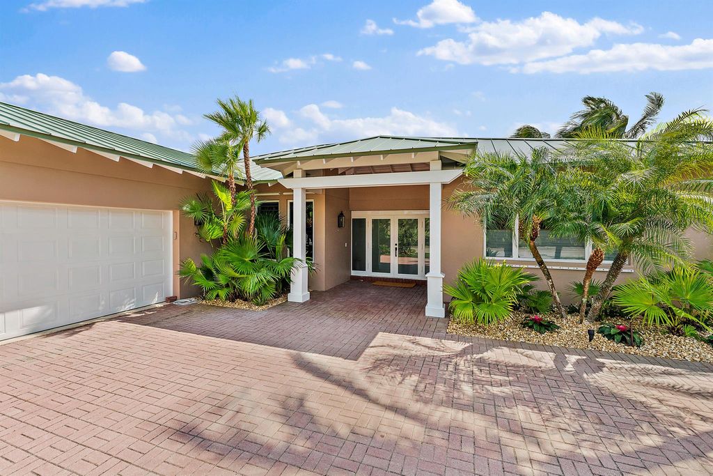 Photo of 28 Coconut Lane N, Tequesta, FL 33469 (MLS # R10971117)