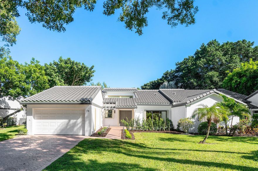 Photos virtually staged. Rare opportunity to own a completely remodeled, 3-bedroom villa in Hampshire at Hunters Run Country Club. This stunning semi-detached residence offers the perfect blend of comfort and luxury. This spacious home boasts 3 true bedrooms, 2 full baths, and a glass-enclosed Florida room across 2,494 square feet of living space. As you step inside, you'll be greeted by an open and airy layout featuring vaulted ceilings, large-format porcelain tile flooring, a contemporary open concept kitchen with stainless steel appliances, a split bedroom layout with a large primary suite with a beautiful spa-inspired bathroom featuring a dual European shower. Two guest bedrooms provide space for hosting your family, with a flex room ideal for a media den setup or home office.