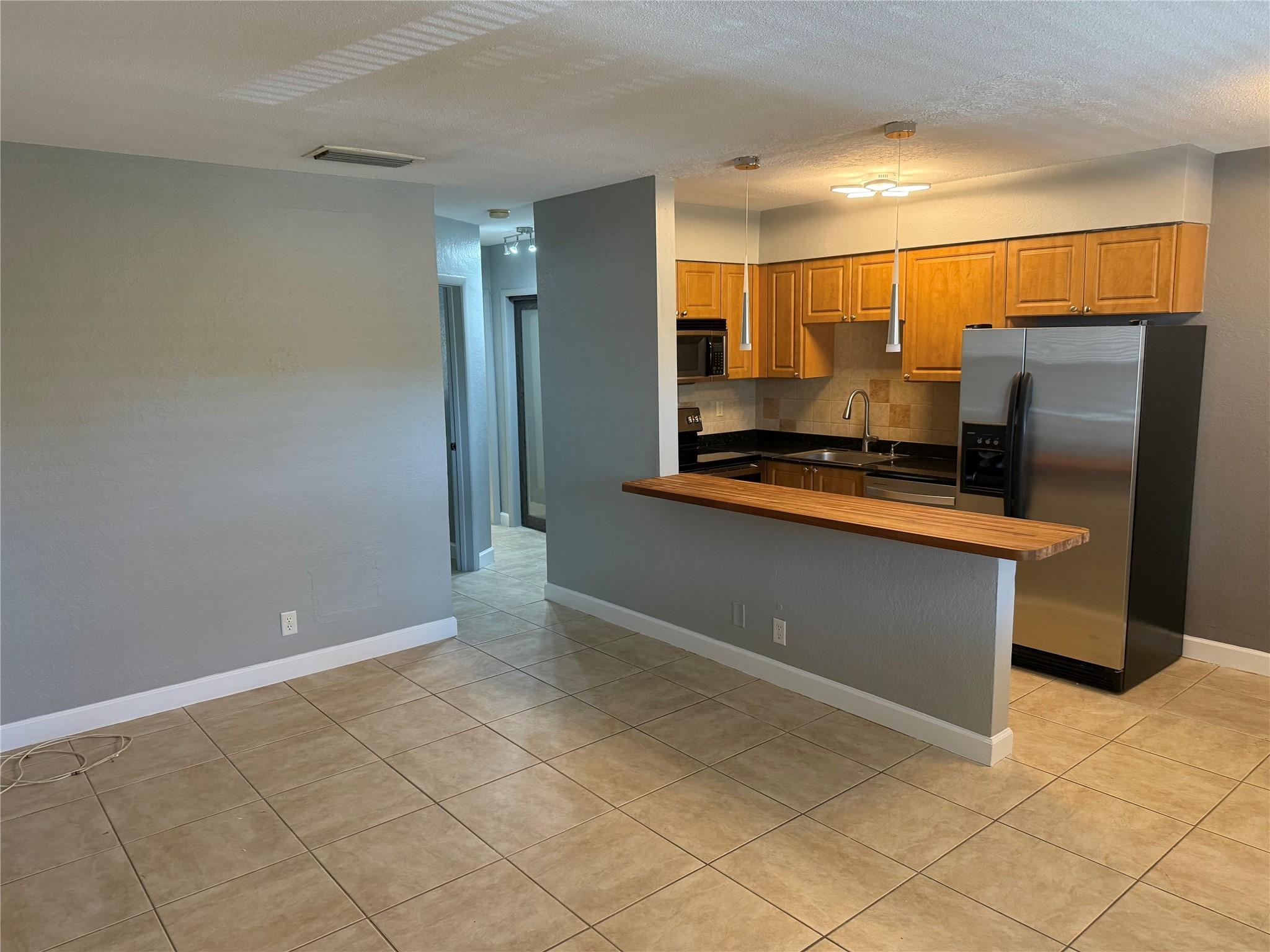 Don't miss this exceptional opportunity to rent a rarely available luxury condo in the vibrant heart of Wilton Manors, just steps away from an array of restaurants, shopping, and lively nightlife. This unit has been beautifully updated with, brand new paint and new lighting through out, creating a modern and inviting atmosphere. Enjoy cooking in the open kitchen equipped with stainless steel appliances, granite countertops, and an upgraded spa-like bathroom. Lots of storage with large closets. Relax by the pool while taking in serene garden views, benefit from the convenience of a private parking spot and plenty of spots for guest. Don't miss your chance to experience the best of Wilton Manors living! No Smoking.