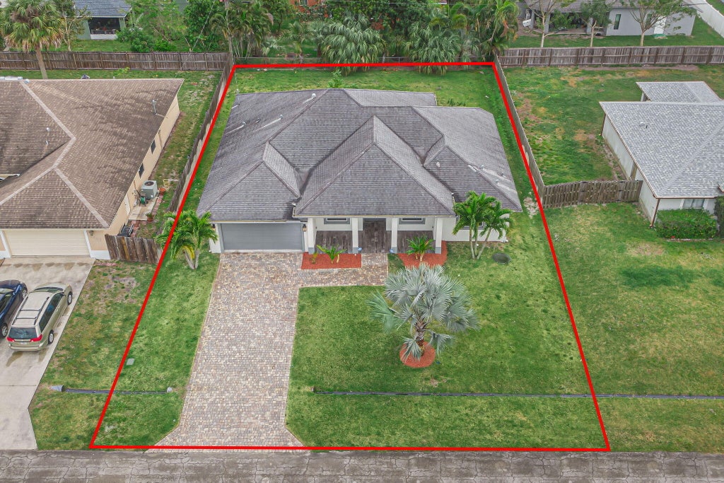 Photo of 4449 SW Gainsboro Street, Port Saint Lucie, FL 34953 (MLS # R10966455)