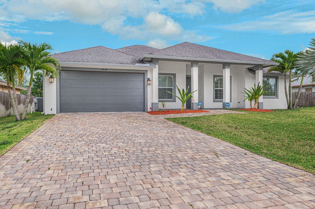 Photo of 4449 SW Gainsboro Street, Port Saint Lucie, FL 34953 (MLS # R10966455)