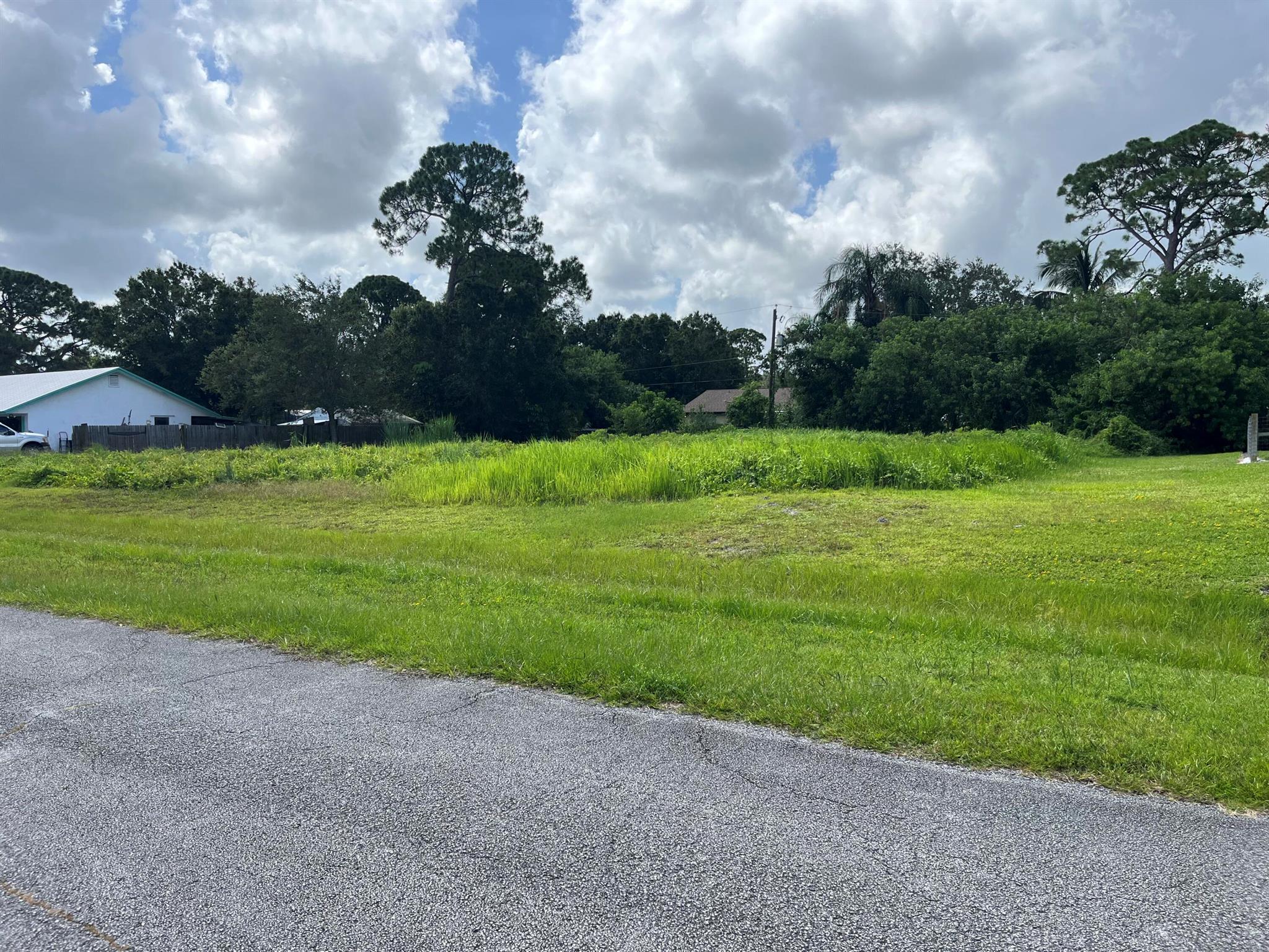 Almost half of an acre lot in Lakewood Park, come build your dream home or great for investors. The main brush and trees have been cleared. The seller has a unique house plan and survey ready for the new buyer if they would like the plans. This lot is close to shopping, Vero Beach and the Beach. Do not miss out on this unique large lot. Plenty of room for your home and all of your toys.Well established neighborhood and voluntary HOA with no restrictions.