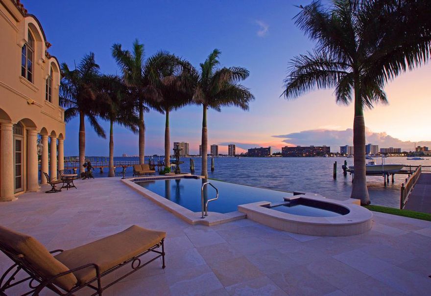 This custom built quality home is on a half acre point lot with spectacular wraparound water views! Dock a 130 ft yacht and only a 5 min walk to the private beach club. 8,800 square feet of luxury! Located in LTV a private oceanfront golf course community. 6 bedrooms, 7.5 baths, 2 story living room, family room with pecky cypress ceilings, high end kitchen, vanishing edge pool and jaccuzi.