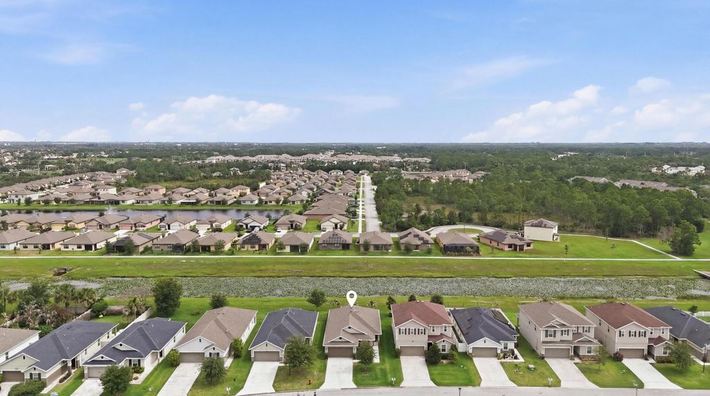 Photo of 5655 NW Pine Trail Circle, Port Saint Lucie, FL 34983 (MLS # B26038148)