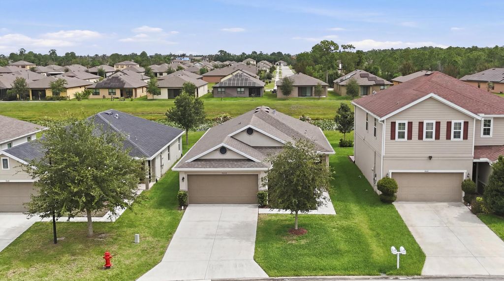 Photo of 5655 NW Pine Trail Circle, Port Saint Lucie, FL 34983 (MLS # B26038148)