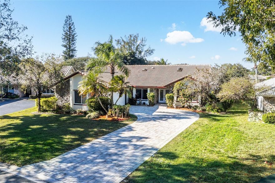 Paradise awaits! Rarely available spacious 4 bdr, 2 ba waterfront pool home situated on an oversized lot. Beautifully appointed kitchen features top of the line granite countertops, rich wood cabinetry, ss appliances, & gas cooktop! Enjoy tranquil waterviews & your resort style pool while cooking in your chef inspired kitchen! Thoughtfully designed split floor plan offers both privacy & generous living space through your family room, dining & living rooms! Pride of ownership is evident at every turn. This home has everything a buyer's heart desires including FULL IMPACT windows & doors for insurance discounts & peace of mind. Located in a no-hoa community & just minutes from A-rated schools, shops, fine dining & houses of worship. This exceptional residence offers both luxury & convenience