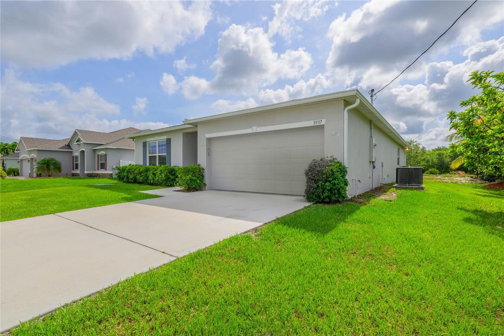 Photo of 3537 SW San Benito Street, Port Saint Lucie, FL 34953 (MLS # F10506621)