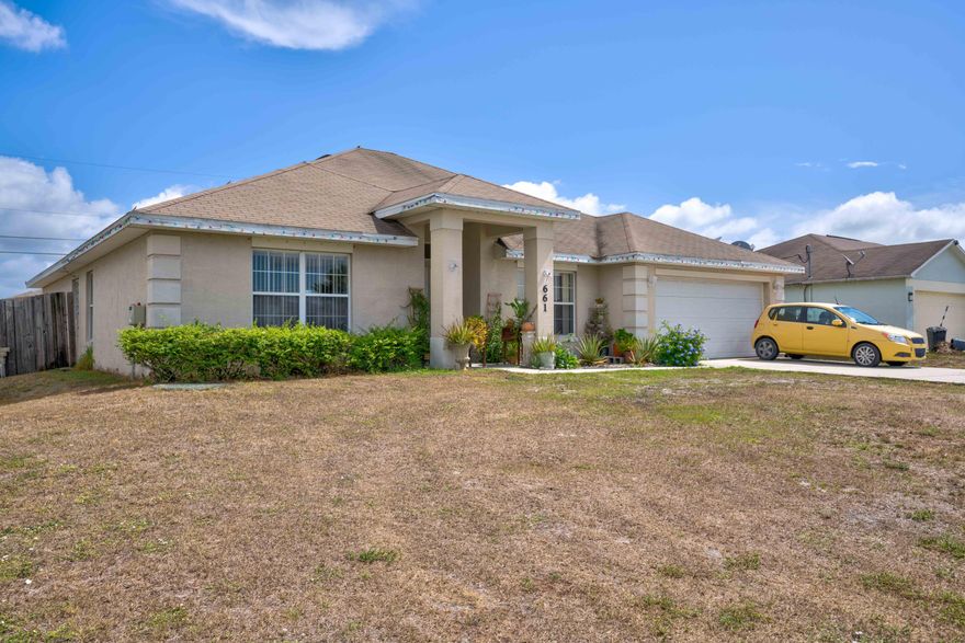 Spacious 4br / 3ba / 2 car gar CBS home with covered patio and fenced-in backyard. This home offers 2 bathrooms in master suite (His & Her), porcelain tile in large living room, red wood cabinets, reinforced garage door, a/c unit is less than a year old and metal storm shutters.
