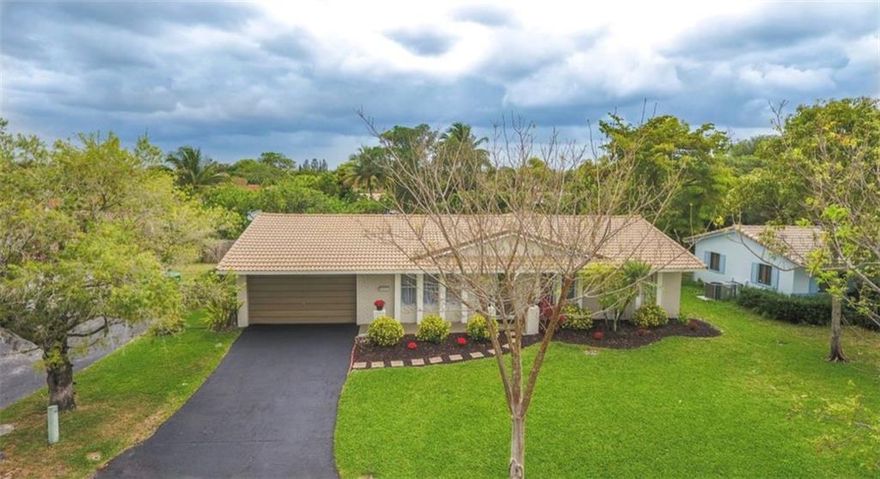 Sold  AS IS.Spectacular 4-2 , Pool, Double Garage Home in the Dells of Coral Springs .Cul De Sac  with house at end of street.New water heater,New Pool Pump, New Washer.No Impact Windows.Secluded tropical pool and covered back porch on beautiful waterfront lot.2189 Total SQ ft. Including 2 Car Garage.