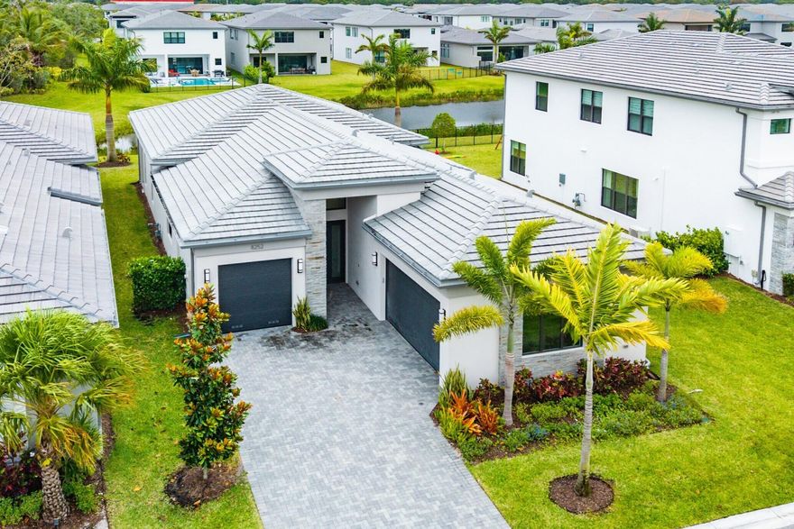 Single story Bermuda home on the lake in Lotus Palm of Boca Raton. 3 bedrooms plus an office/den, 3 1/2 bathrooms and 3 car garage. White tile floors throughout. Upgraded kitchen cabinets. GE appliances. Natural gas cooktop. Sunny south facing backyard with room for a pool. Tranquil setting on the lakefront. Resort-style living with an expansive clubhouse boasting extensive amenities: 6 tennis courts, 5 pickleball courts, the Crave restaurant and pool-side bar, fitness center, yoga garden, full indoor basketball court, children's arcade, gleaming pools and a spa. 24 hour manned guard gate plus roving security patrol. Prime location off Glades Road near all of Boca Raton's best shopping, dining and top rated schools. Live a Floridian dream lifestyle!