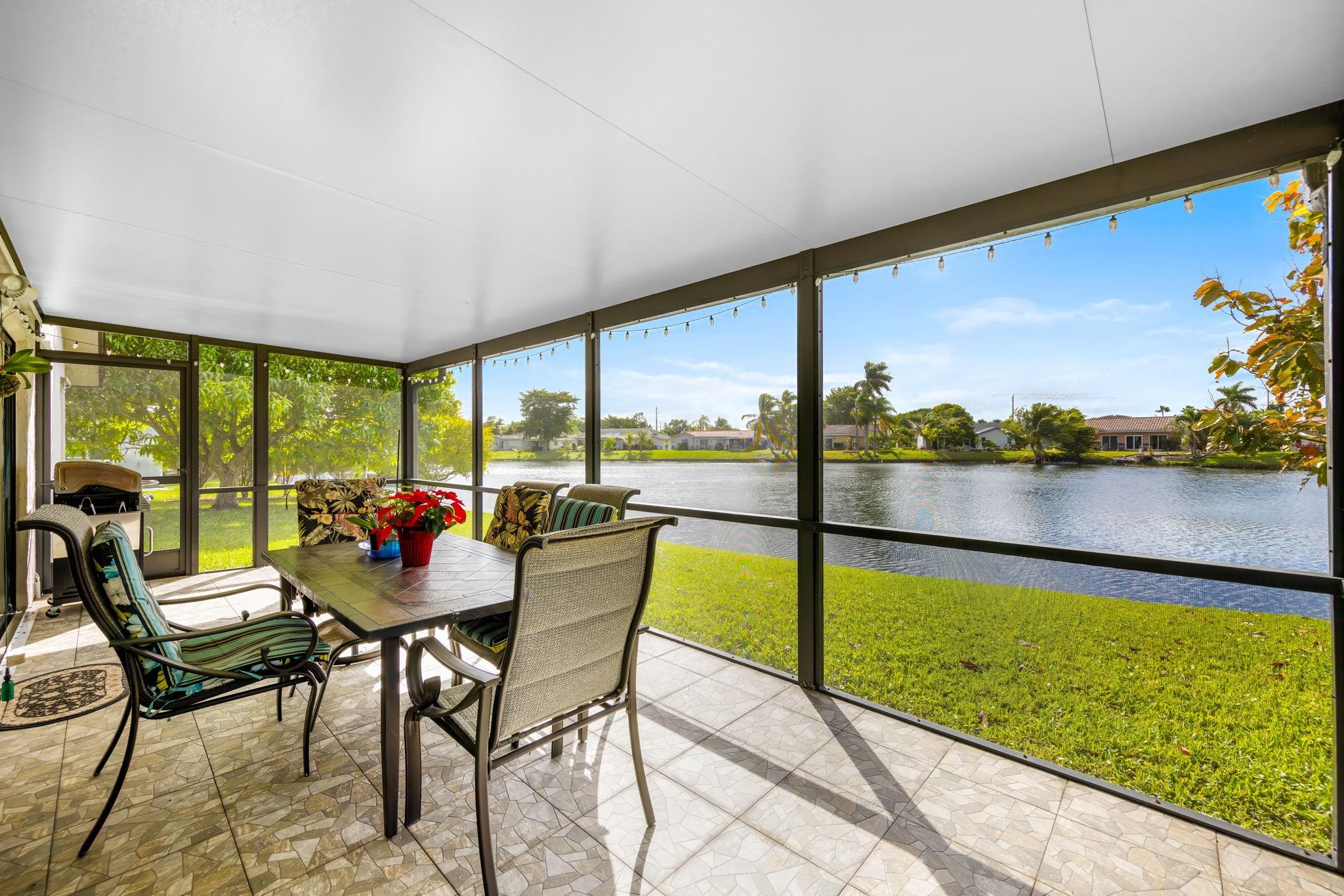 PRICE DROP, Sellers Motivated! This stunning single-family home, in a serene waterfront setting offers the perfect blend of comfort, luxury, & the quintessential FL lifestyle. Located in one of South FL's most sought-after 55+ communities, the Isles of Tamarac. This property provides the ideal retreat for relaxation & recreation with a community pool, clubhouse, tennis & pickleball courts. The Kitchen features granite counters & plenty of cabinets. The Primary Bedroom has waterfront views, an Ensuite Bathroom & huge Walk-In Closet. Main living area has open floor plan, high ceilings & plenty of natural light. The screened-in lanai provides a peaceful lake front patio. Spacious 1.5 car Garage with Washer & Dryer. Hurricane Shutters for insurance discount. Low HOA fees at $30/month.