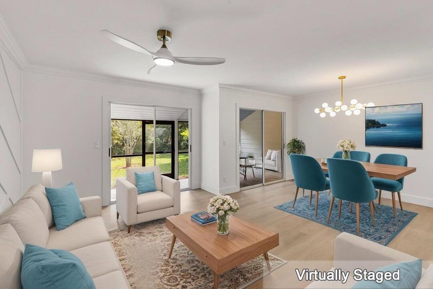 Welcome to Holly Creek, a sought-after community in beautiful Jensen Beach.This newly remodeled charming 2-bedroom, 2.5-bath townhome blends comfort and style with a serene preserve and lake view. The main level features elegant crown molding and LVP flooring, while the upstairs offers durable LVP as well. The spacious kitchen includes quartz countertops, a tiled backsplash and stainless appliances. Additional upgrades include a new garage door, epoxy-finished garage floor, and screened patio perfect for relaxing outdoors. Enjoy peace of mind with a 2021 shingle roof and 2020 A/C. Other highlights include ceiling fans throughout, original windows, and a one-car garage with two parking spaces. Community amenities include a pool, clubhouse with kitchen and TV lounge, tennis and pickleball