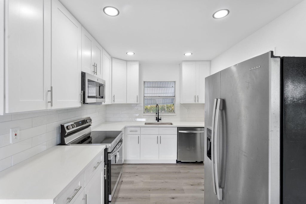 Photo of 316 NW 6th Court, Deerfield Beach, FL 33441 (MLS # B26057469)