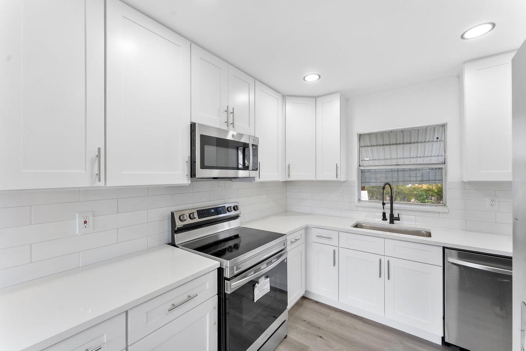Photo of 316 NW 6th Court, Deerfield Beach, FL 33441 (MLS # B26057469)