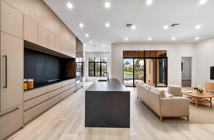 Absolutely gorgeous, completely renovated from top to bottom, this stunning home is located in the exclusive Parkland Golf & Country Club and features top-of-the-line, modern finishes throughout. The owner has spared no expense, installing new floors, a state-of-the-art kitchen, fully remodeled bathrooms, and adding a brand-new security system with six cameras. The property also features ceiling fans, a motorized garage gate, and a new EV charger for modern convenience. Enjoy luxury living in a premier, gated golf community with exceptional upgrades and attention to detail in every corner. This is an exceptional opportunity!