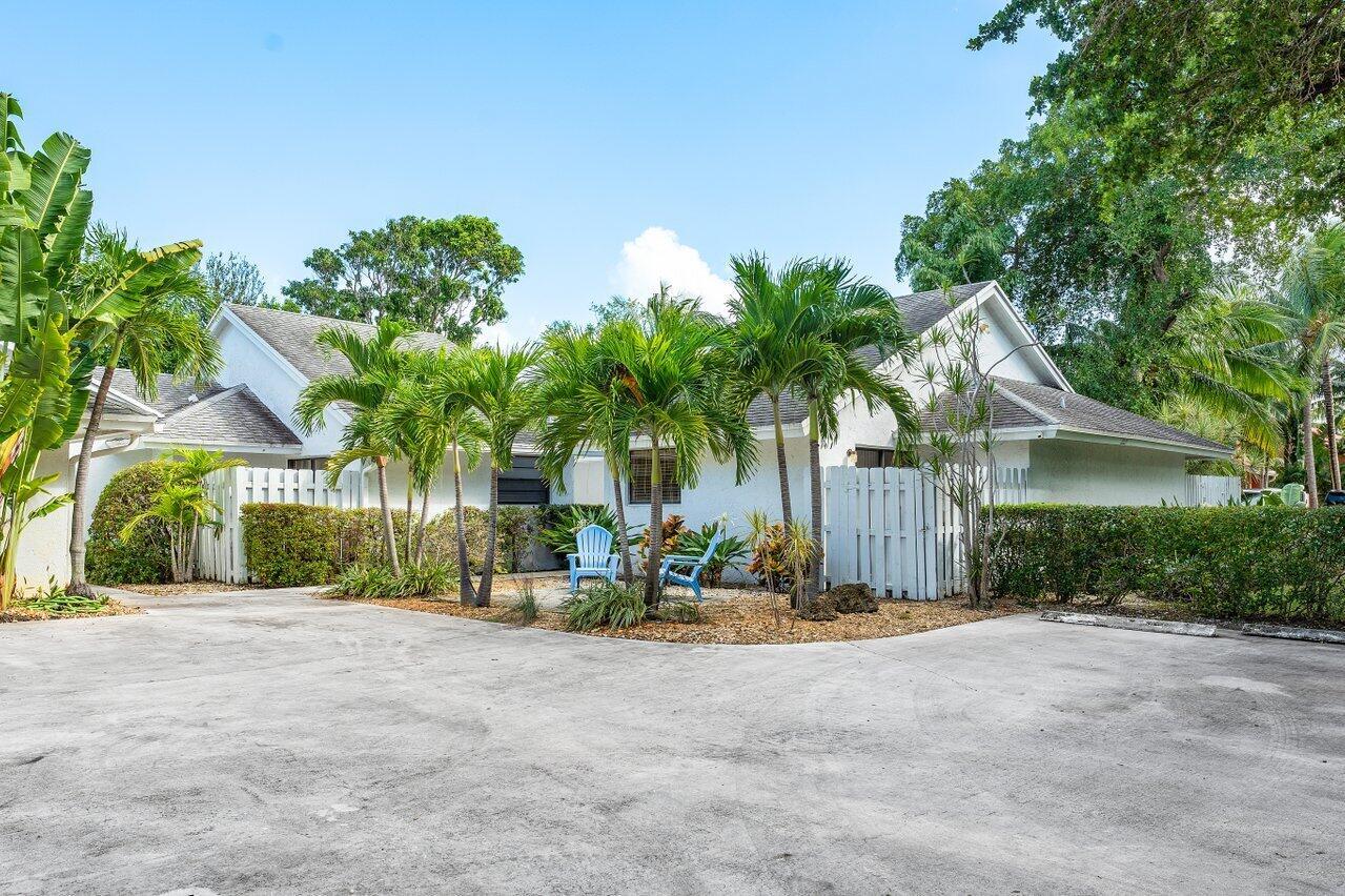 Welcome to Villa Tropic Isle compound, a rare gem in East Delray's coveted upscale Tropic Isle neighborhood. A unique offering, this luxury triplex offers three 2-BR 2-BA ensuite residences, each a chic coastal retreat. Whether you're seeking an incredible investment opportunity or a spacious family compound, Villa Tropic Isle is your tropical paradise in Delray Beach.Each coastal residence offers elegant interiors, vaulted ceilings, and lush private, professionally landscaped outdoor space for your enjoyment. Two of the three residences come with private pools featuring tranquil waterfalls. Each furnished villa lives like a single-family home, equipped with Smart TVs, high-speed internet, central air, and a washer/dryer, offering all the comforts of modern living.