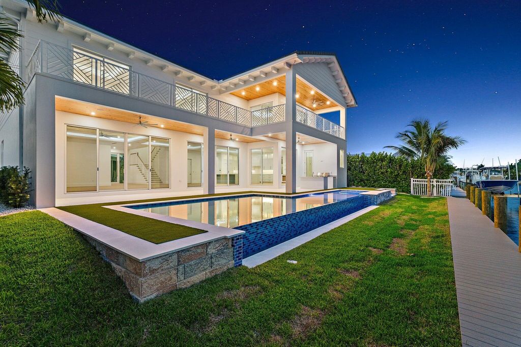 Photo of 20 Tradewinds Circle, Tequesta, FL 33469 (MLS # R11096416)