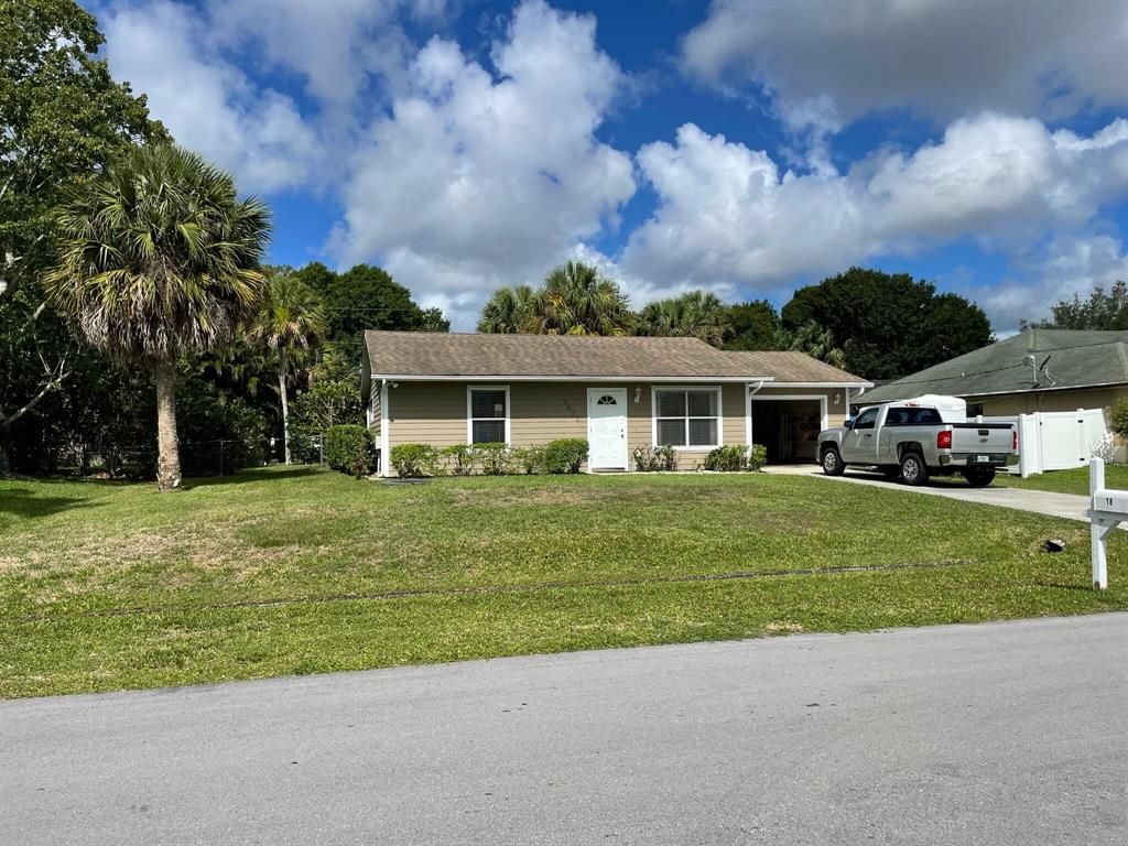 Photo of 3822 SW Crary Street, Port Saint Lucie, FL 34953 (MLS # R10805555)