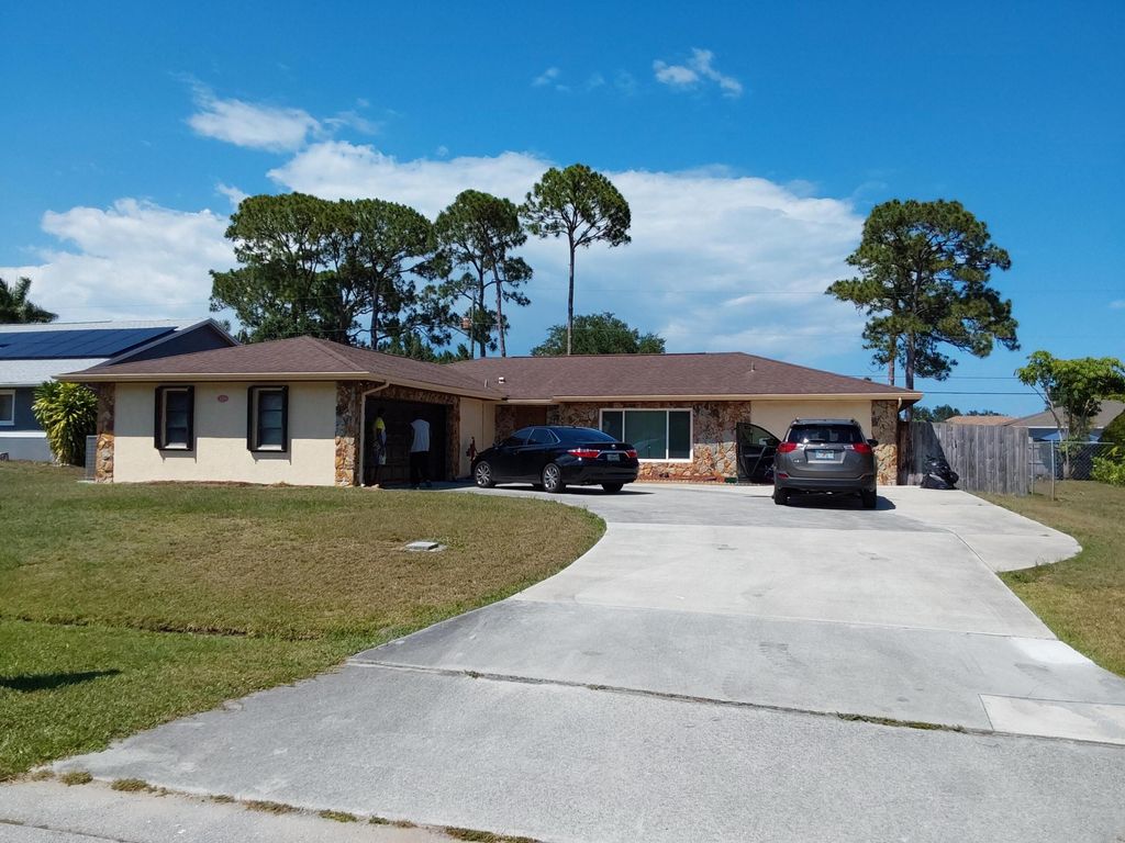 Photo of 1179 SE Proctor Lane, Port Saint Lucie, FL 34953 (MLS # R11105940)